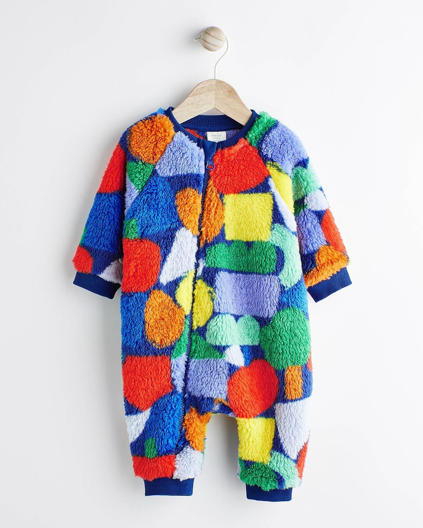 Multi Color Fleece Footless Zip Romper.